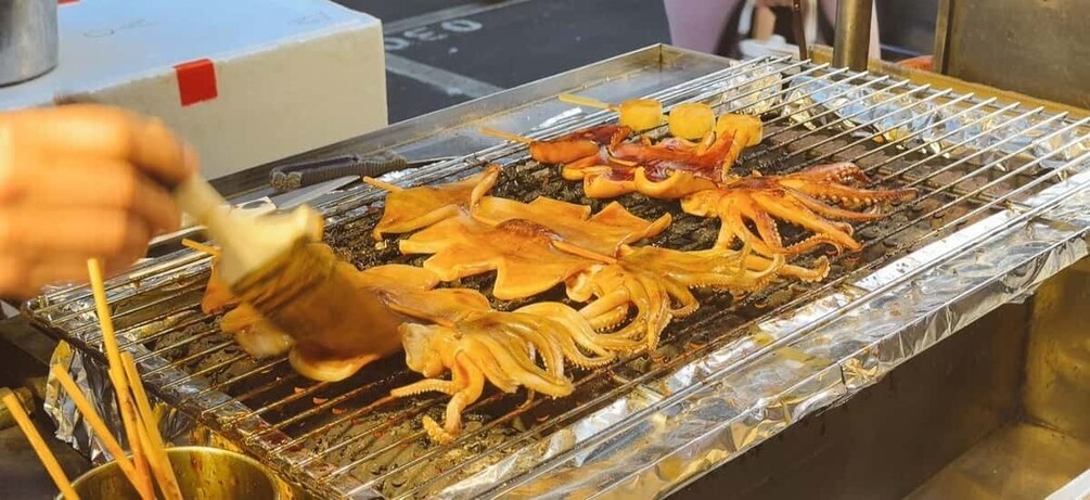Grilled octopus on a metal grill. 4