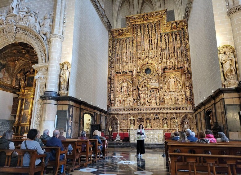 A church interior with ornate altars and a congregation seated. 1