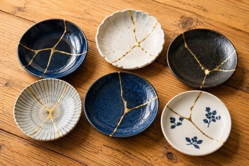 Six ceramic bowls with unique crackle patterns on a wooden surface. 2