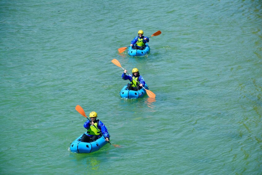 Two people kayaking on a calm body of water. 5