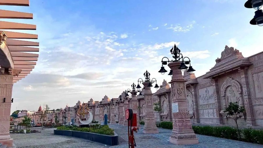A temple complex with intricate carvings and a large crescent moon sculpture. 5