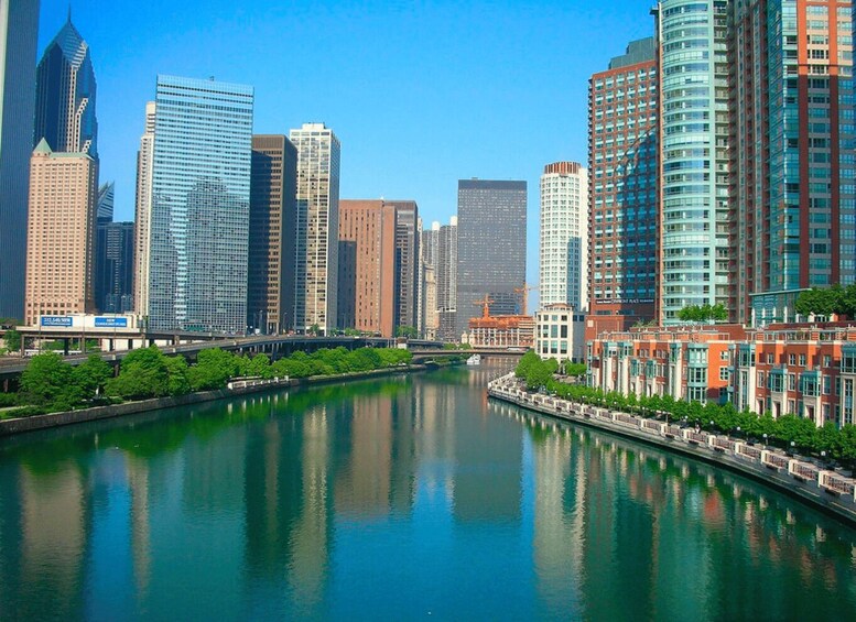 A river with modern skyscrapers on one side and traditional buildings on the other. 2