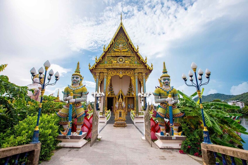 A temple with ornate golden architecture, a central shrine, and statues on either side. 3