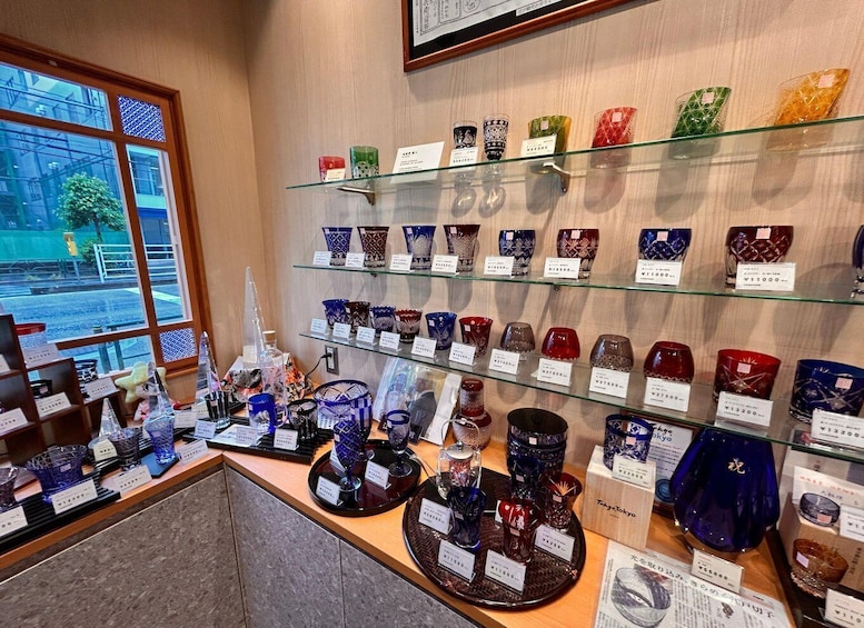 A display of glassware with price tags in a store. 5