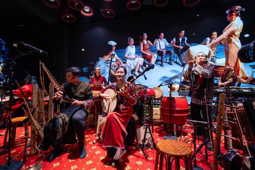 A group of musicians performing on a stage with traditional instruments. 5