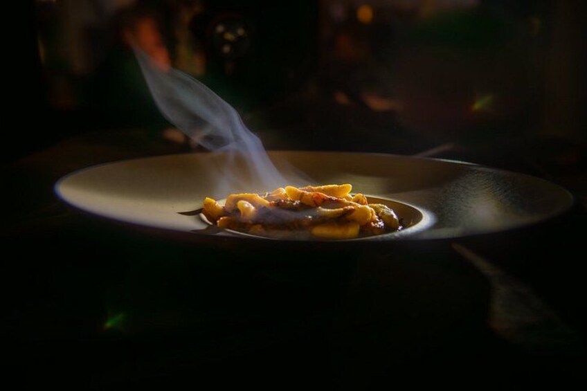 A plate of food with steam rising from it, suggesting it is hot. 2
