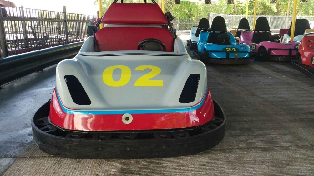 A row of bumper cars with numbers 02, 21, and 25 visible. 2
