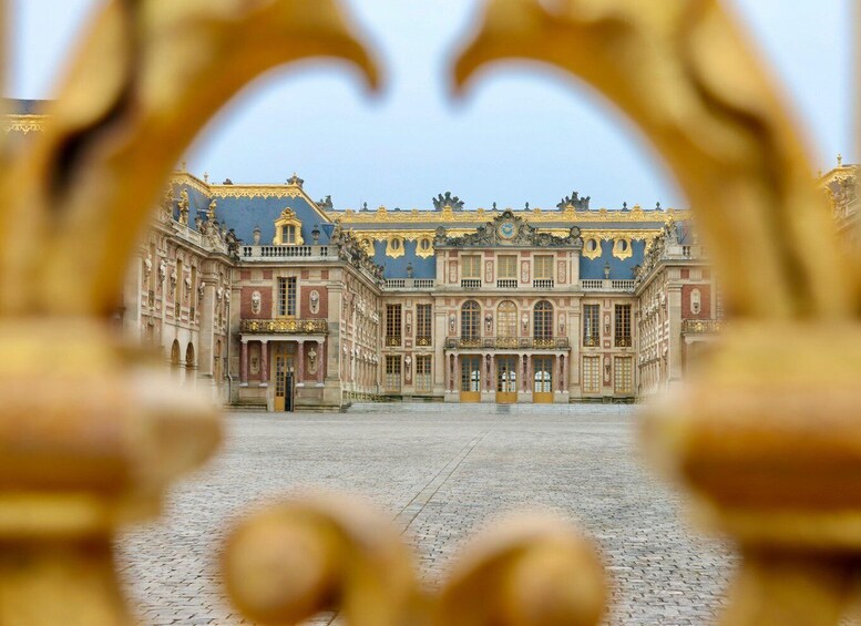 A grand palace with ornate architecture and a large courtyard. 2