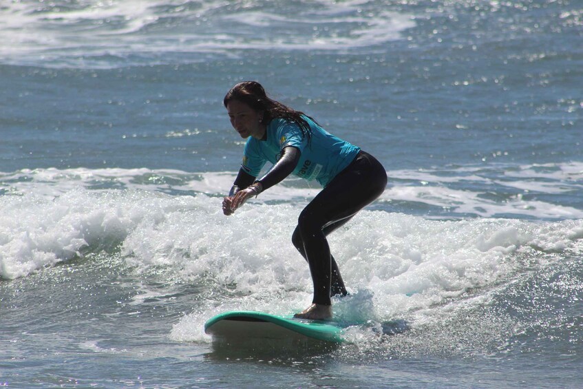 A person surfing on a wave. 2