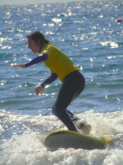 A person surfing on a wave in the ocean. 2
