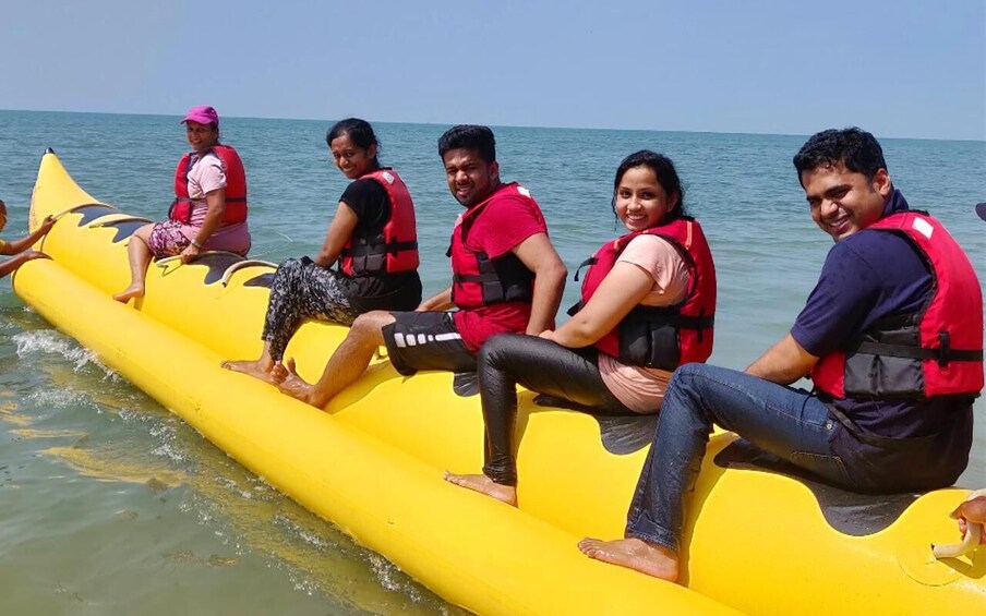 People on a yellow inflatable raft in the water. 1