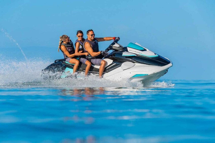 A person riding a jet ski on a body of water. 5