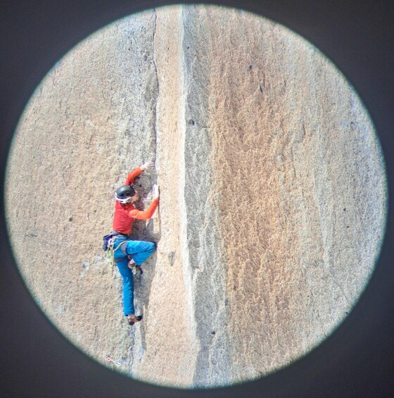 A person climbing a rock face. 2