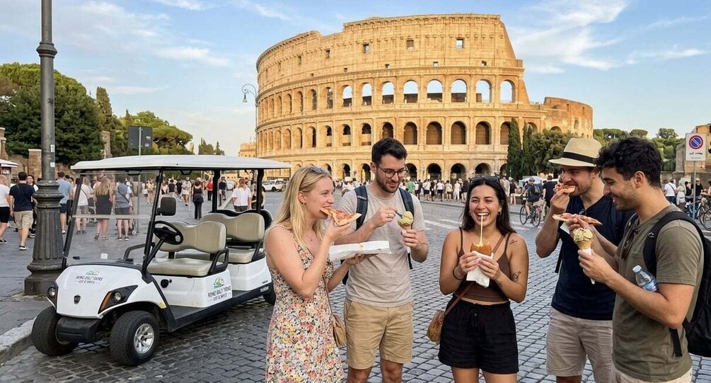 Tourists eating pizza in front of the Colosseum. 5