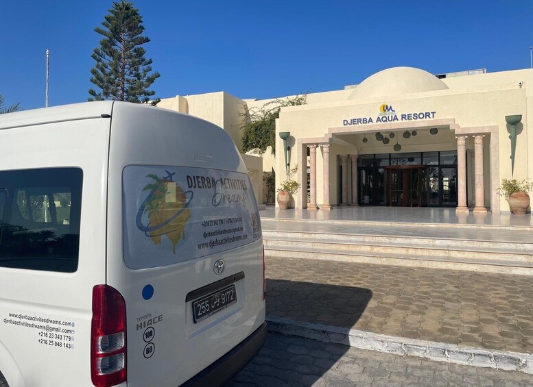 A white van parked in front of the Djerba Aqua Resort. 5