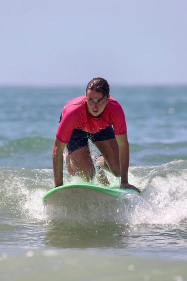 A person surfing on a wave in the ocean. 3