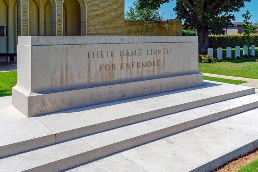 A memorial with steps leading up to it, engraved with 'THEIR NAME LIVETH FOR EVERMORE.' 5