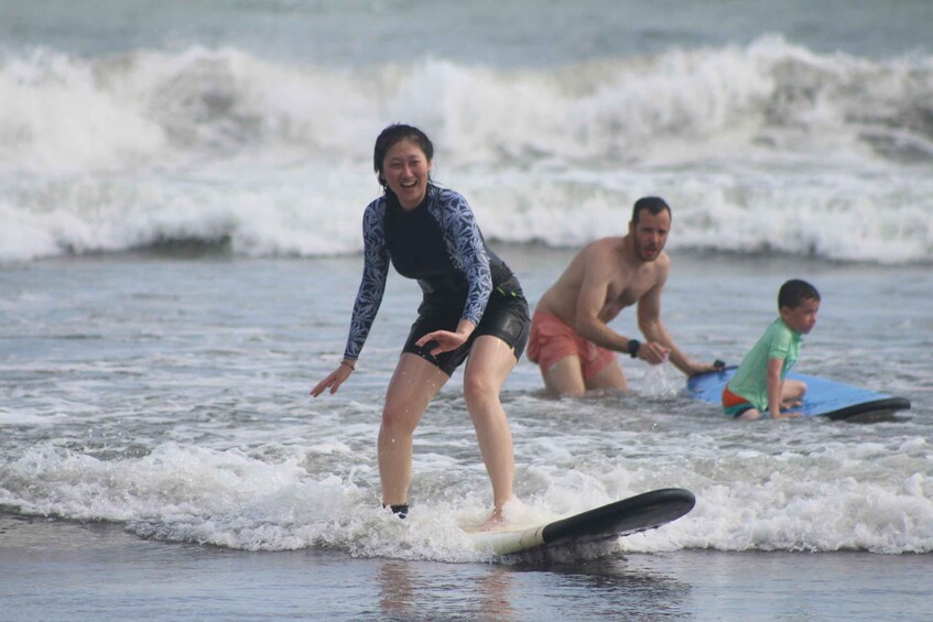 A person surfing on a wave at the beach. 1
