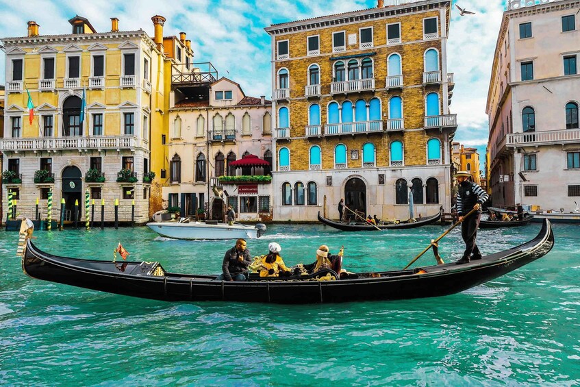 A gondola on a canal in Venice, surrounded by historic buildings. 5