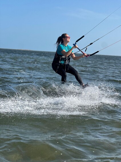 A person windsurfing on the water. 3