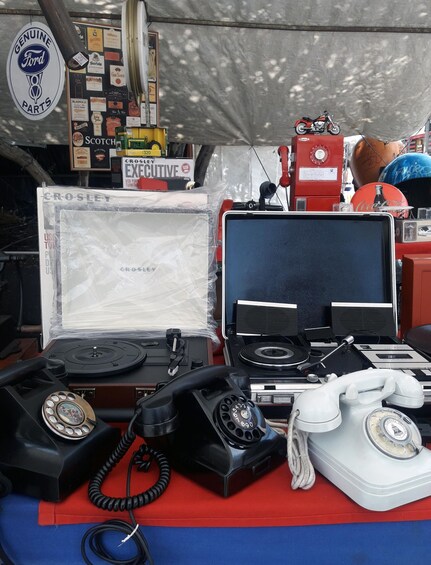 Vintage items including a Crosley radio, a vintage telephone, and a model motorcycle. 3