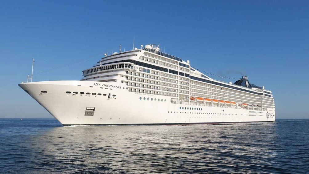 A large cruise ship named MSC ORCHESTRA cruising on the ocean. 1