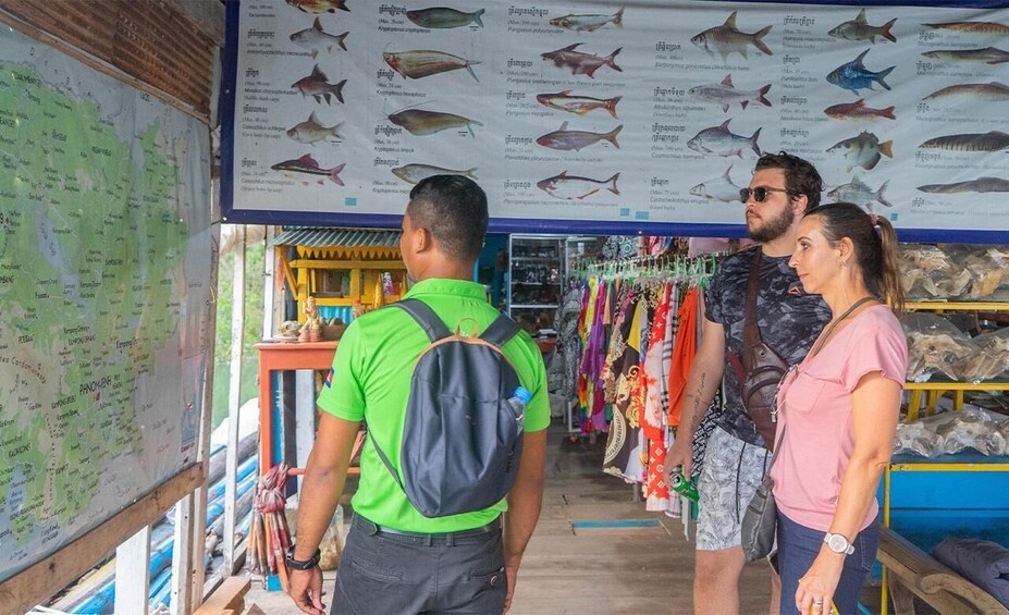A shop with a wall map and fish illustrations. 4
