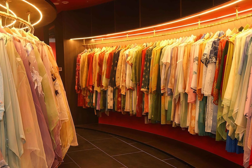 A clothing store with a variety of colorful garments on display. 4