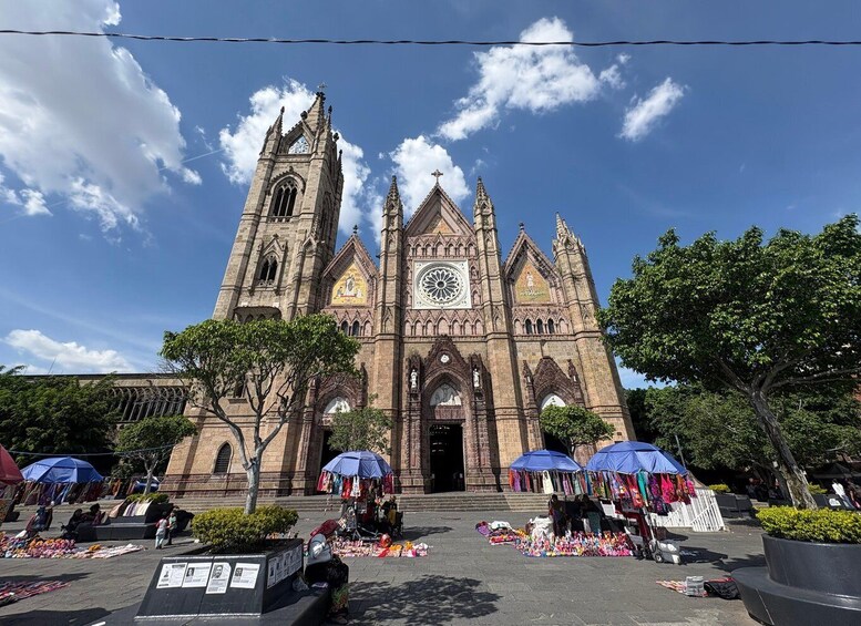 A historic cathedral with a clock tower and stained glass windows. 3