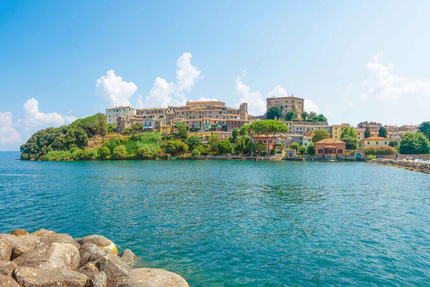 A coastal town with buildings on a hillside overlooking the sea. 3