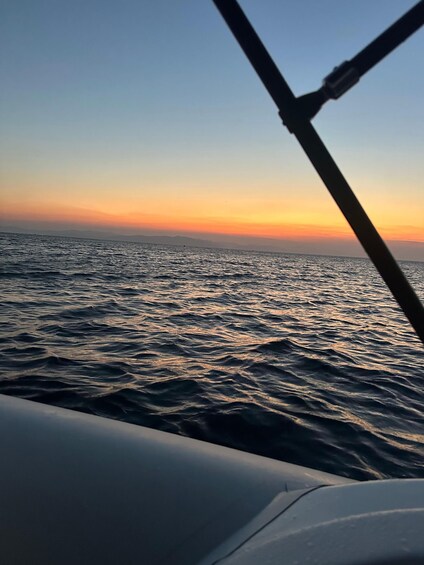 A sunset over the ocean with waves. 5