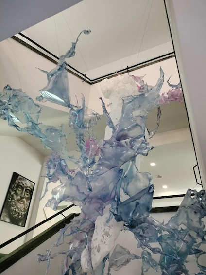 A modern interior with a large abstract glass sculpture. 2