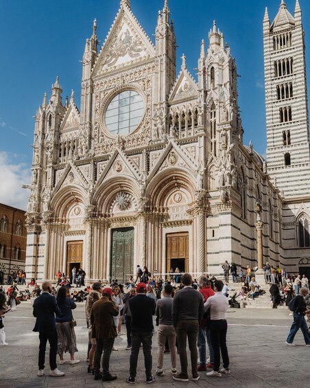 A Gothic cathedral with intricate architecture and a large clock tower. 2