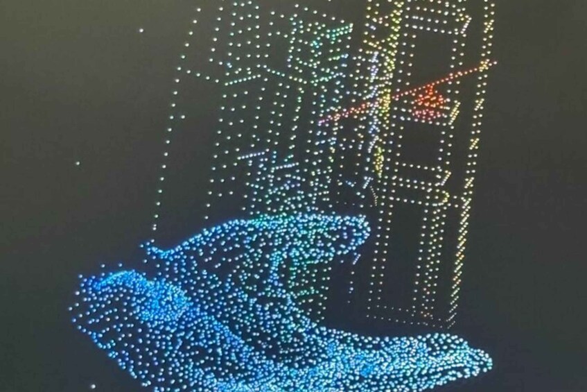 A blue and yellow dot matrix sculpture on a dark background. 3