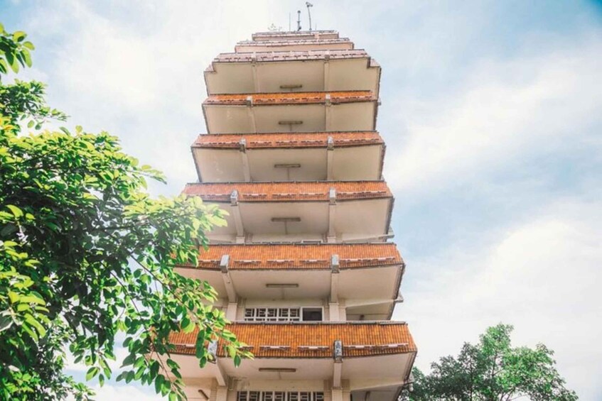A multi-story building with a unique tiered roof design. 4