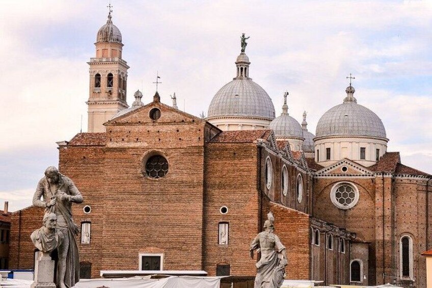 A historic church with multiple domes and a bell tower. 3