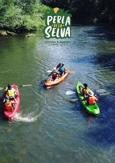 Three kayaks on a river surrounded by greenery. 2