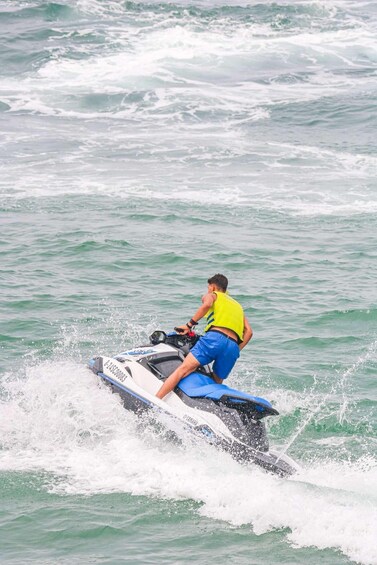 A person riding a jet ski on the water. 5