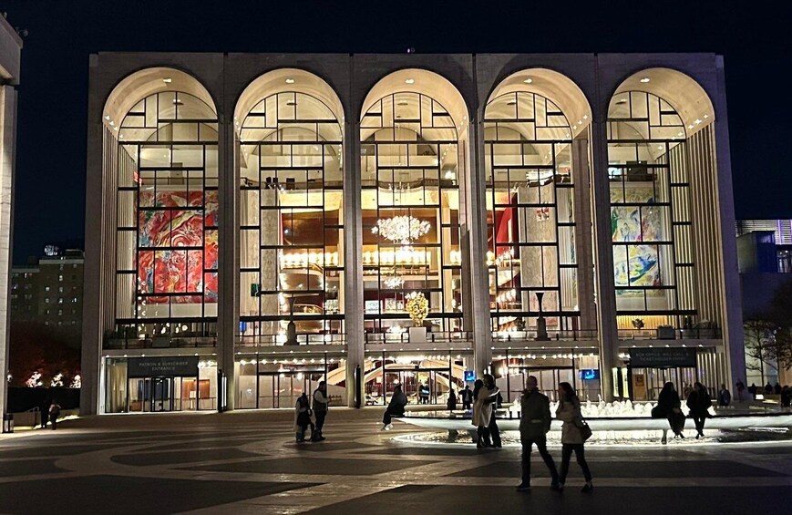 A modern building with arched windows and a central atrium. 1