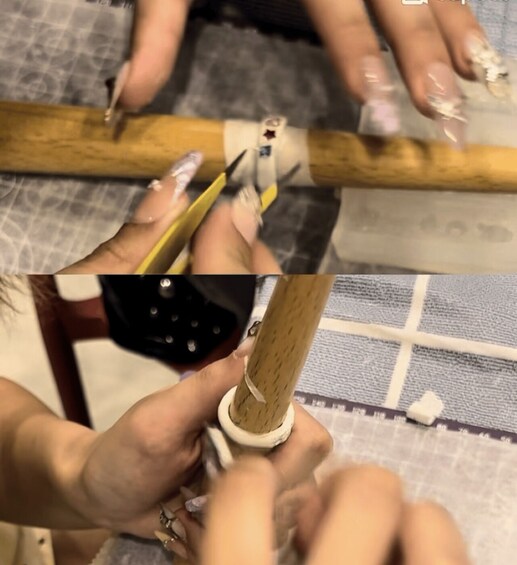 A person using a tool on a wooden object. 3