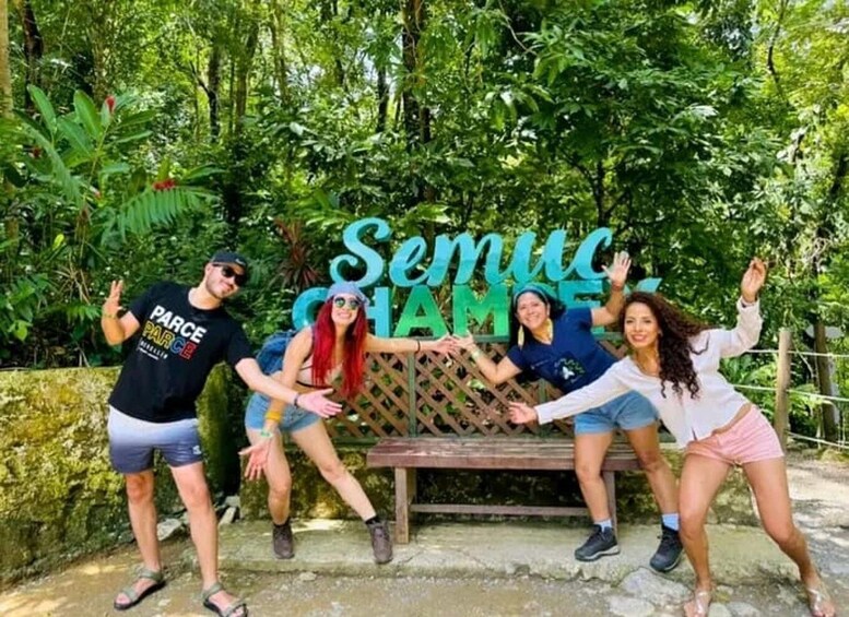 A group of people posing in front of a sign that reads 'Semic Chame.' 4