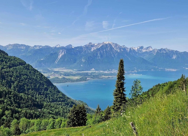 A mountainous landscape with a lake and a clear sky. 1