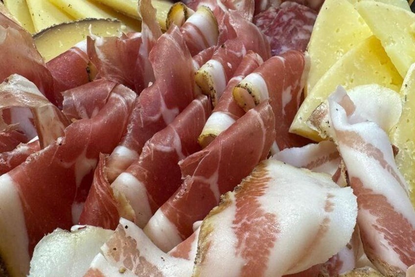 A variety of cured meats and cheeses. 3