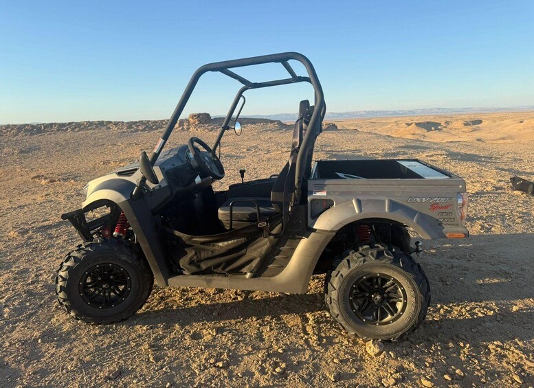 A utility vehicle in a desert landscape. 3