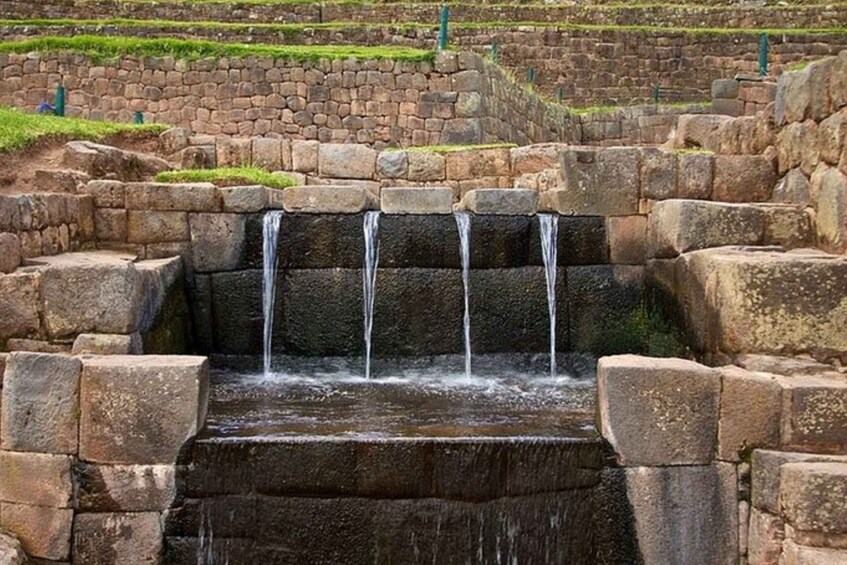 A stone water feature with multiple cascades. 2