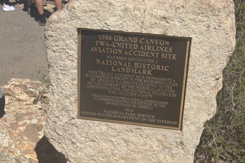 A plaque on a rock with historical information about the 1956 Grand Canyon TWA-United Airlines accident site. 3