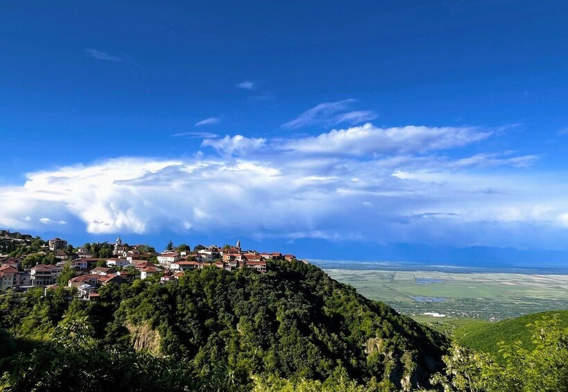 A village on a hill with a clear sky. 3