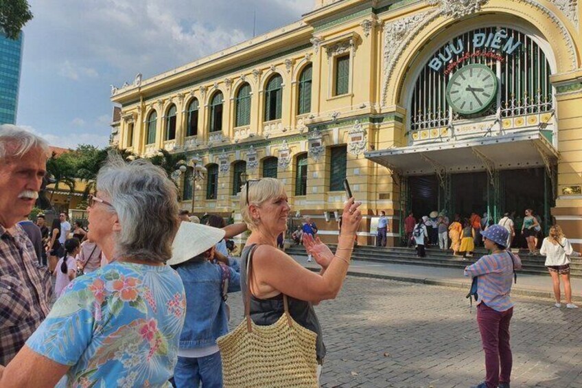 A historic building with a clock and a sign that reads 'Blu Biens.' 2