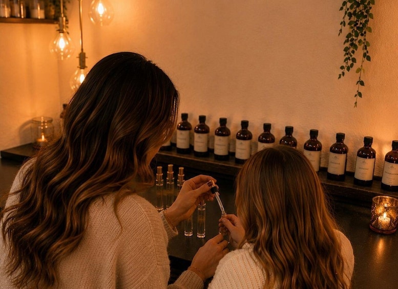 Two people examining small bottles on a shelf. 4