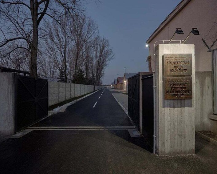 A gated entrance with a sign for the St. Louis Expo Museum. 2
